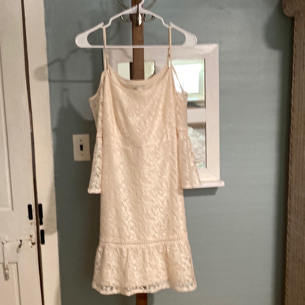 New/Never Worn Ivory Colored Dress Fully Lined with Ivory Lace Overlay. Size M